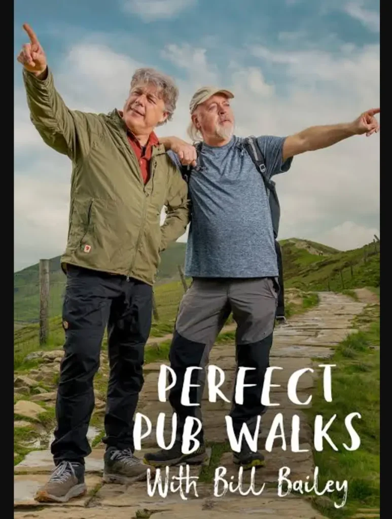 image of two men pointing in different directions on top of a hill