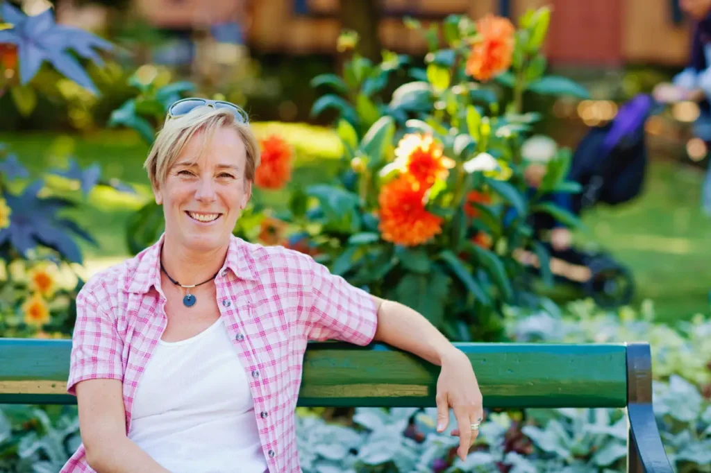 Cecilia Svensson sitting on a bench and smiling